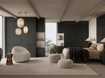 charcoal bedroom with hanging lights and a grey sofa chair