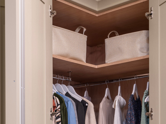 Corner fitted wardrobe maximising bedroom space